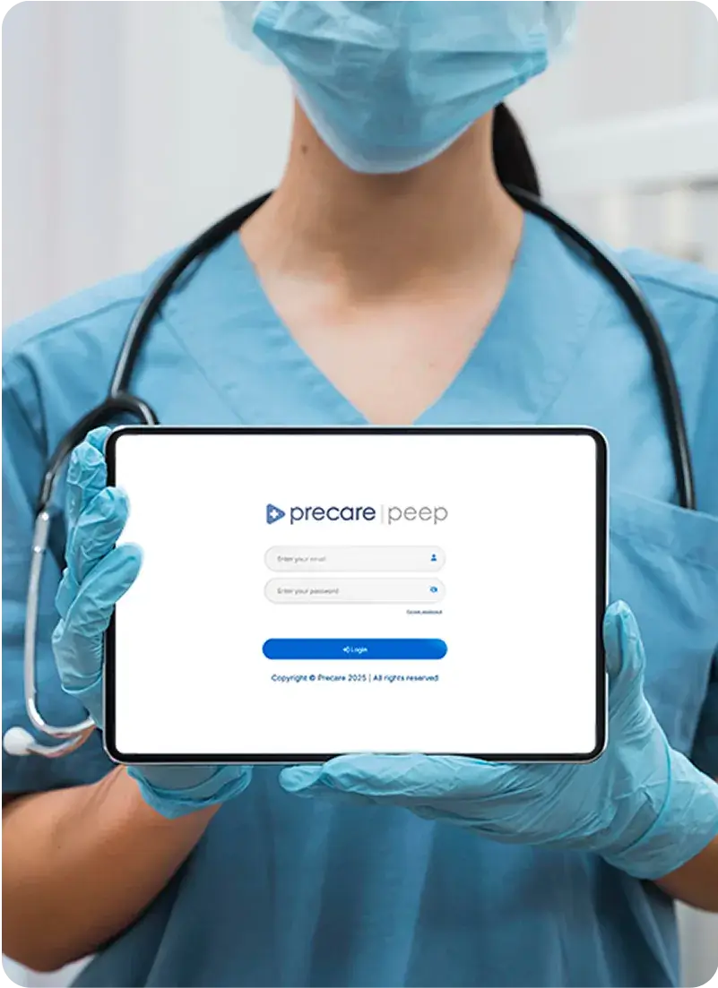 Nurse holding laptop showing PEEP Portal.